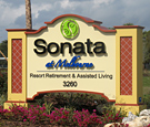 Sonata Memory Care - Monument Sign with reverse channel letters and routed copy with push-through acrylic decoration