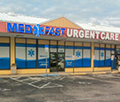 MedFast Urgent Care in Cocoa Beach, FL - Large-format digitally-printed perforated vinyl overlay across storefront