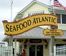 Seafood Atlantic - Non-Illuminated Dimensionally Routed Pole Sign and Secondary Panel installed on existing poles